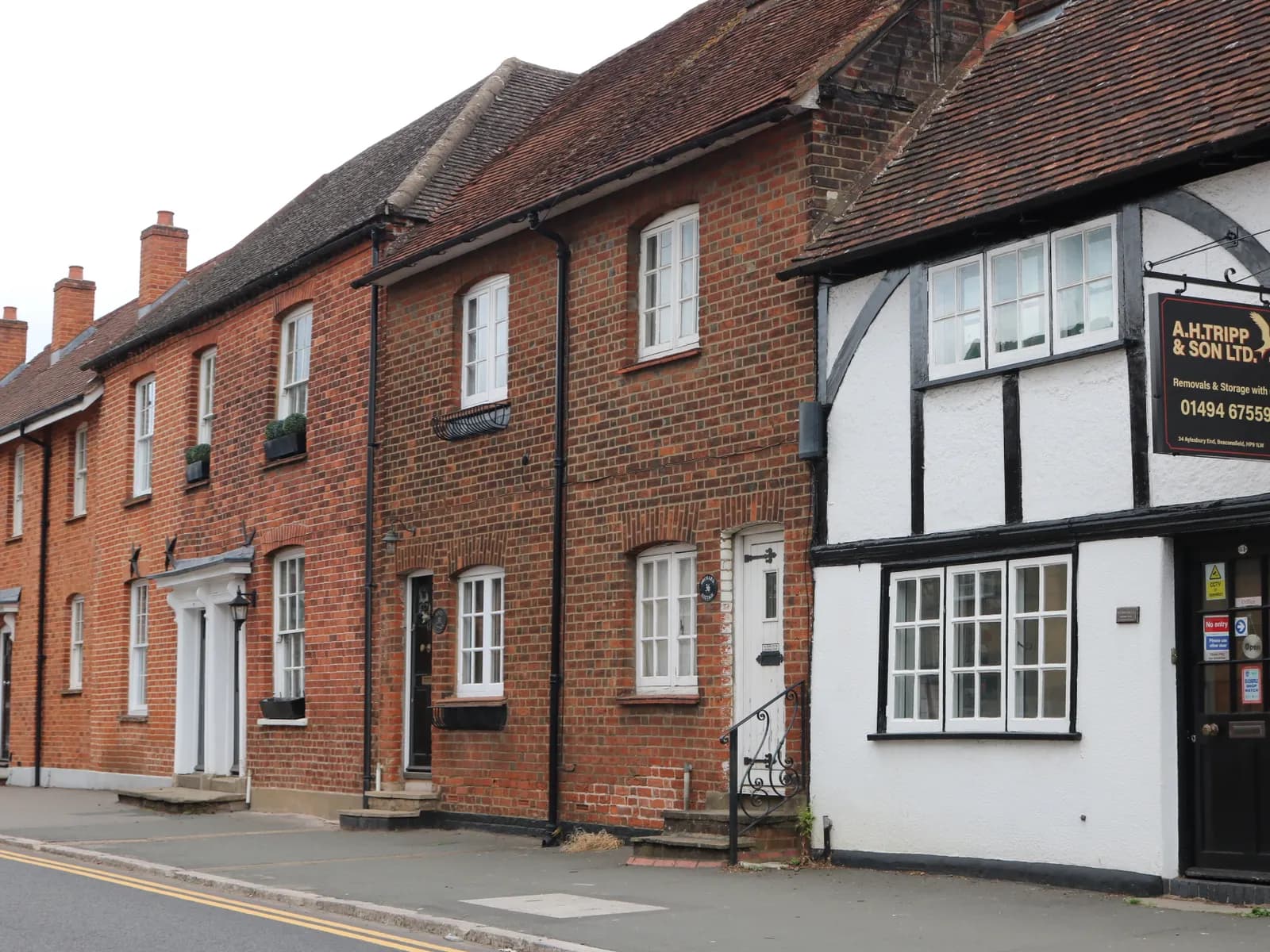Historic red-brick and timber-framed buildings on Aylesbury End in Beaconsfield Old Town