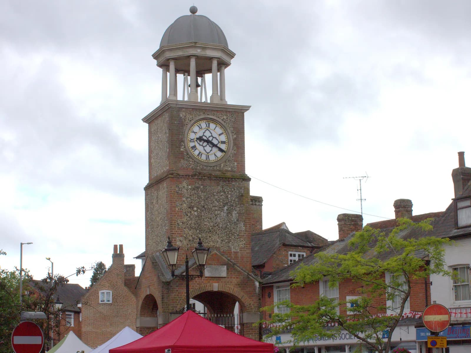 The flint and brick clock tower in Chesham market square