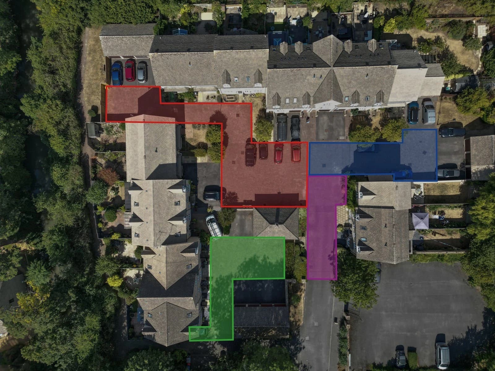 Drone plan of a managed residential development with four work zones outlined, numbered and colour-coded