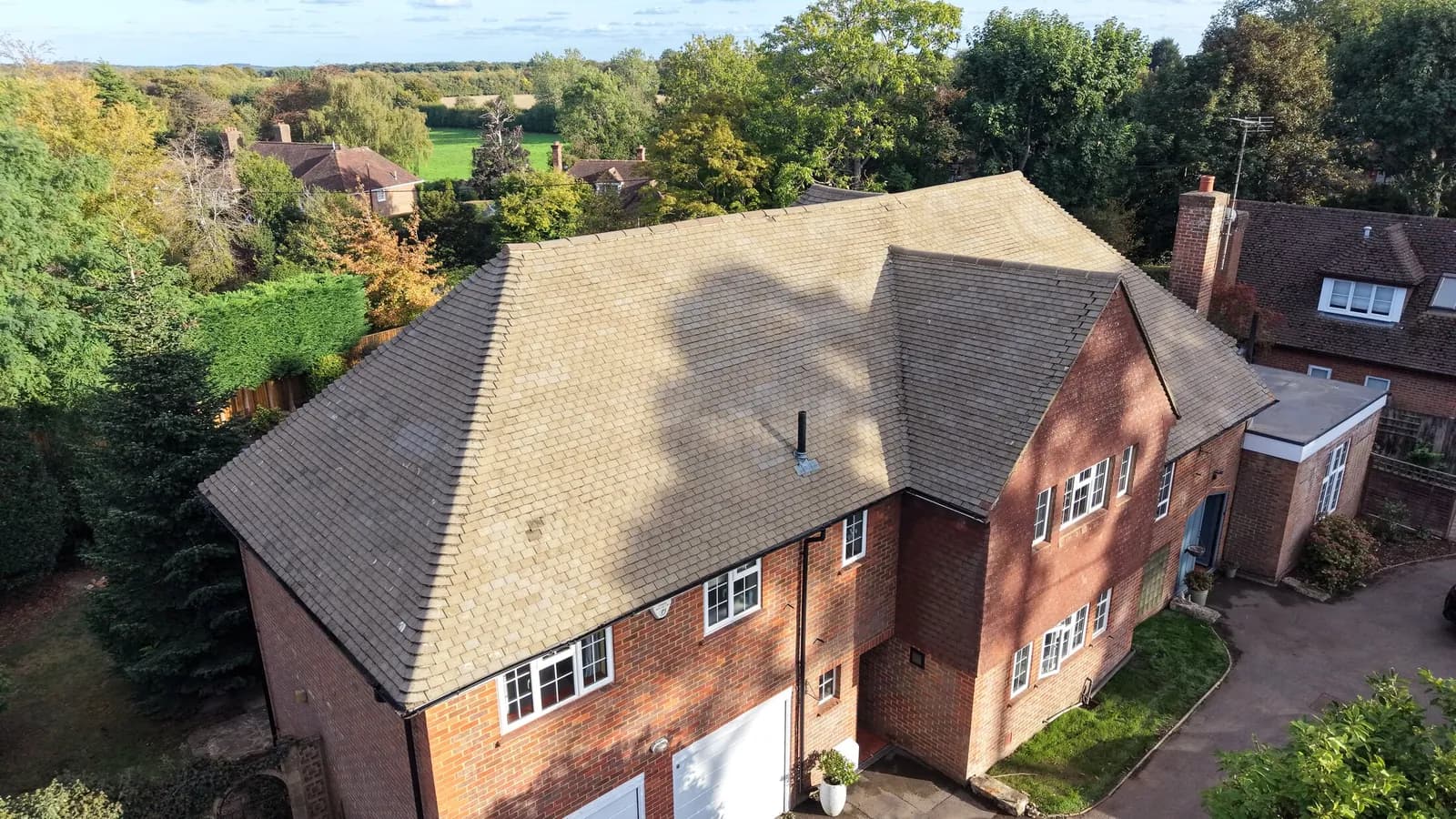 The same concrete tile roof in Great Missenden after cleaning and Chiltern EverGuard™ treatment