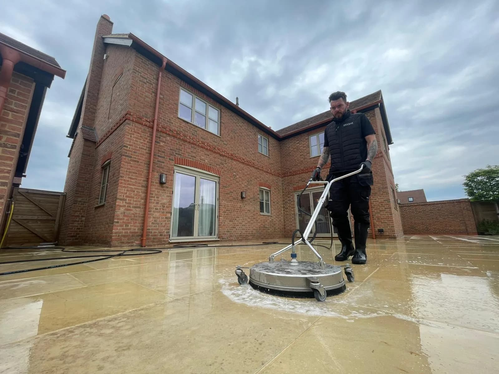 Chiltern Surface Co operative cleaning a paved surface, the whole property in view