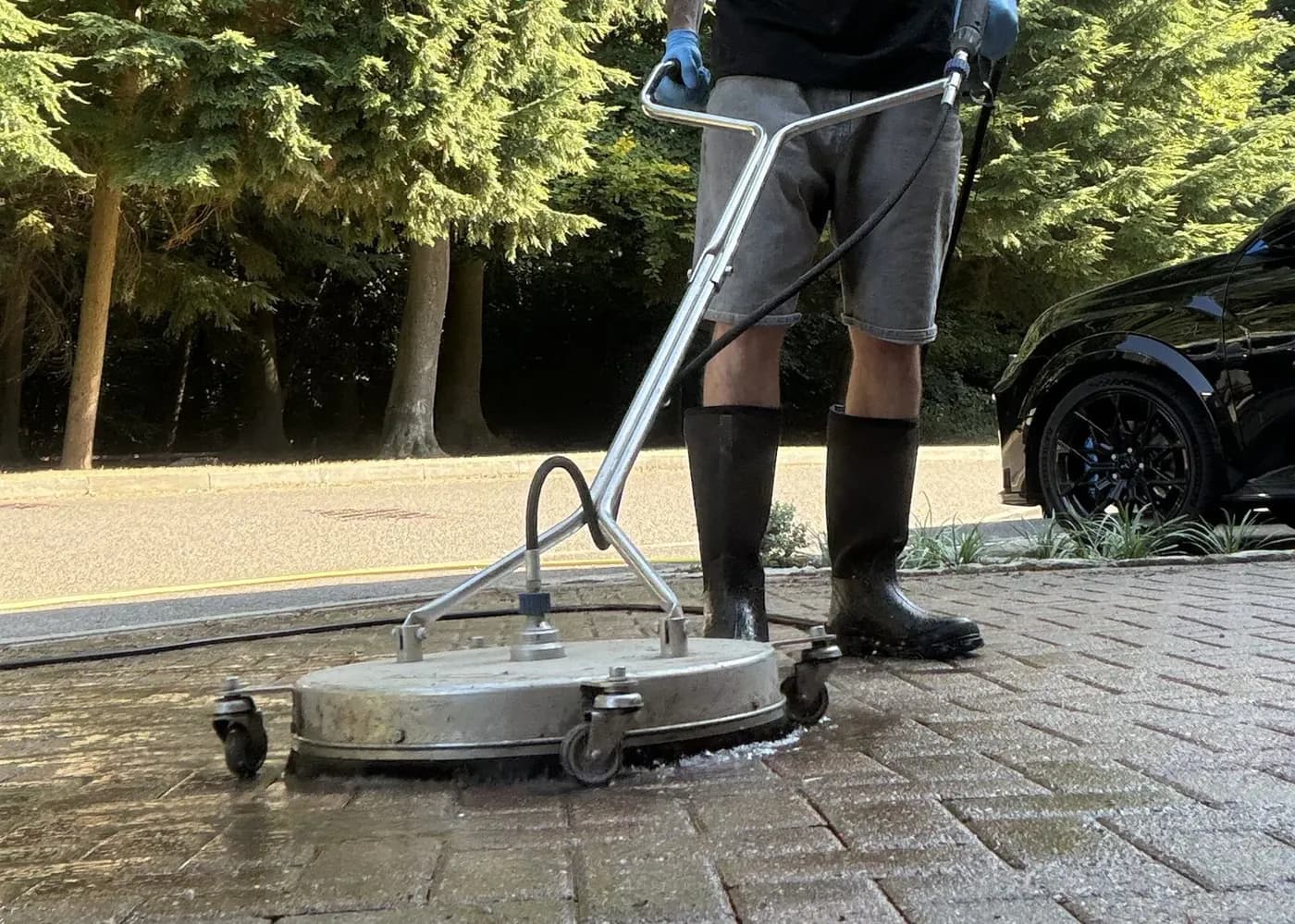Chiltern Surface Co technician deep cleaning a block-paved driveway