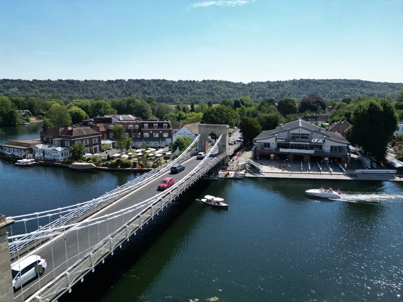 Aerial view of Marlow suspension bridge over the River Thames with the Chiltern hills beyond
