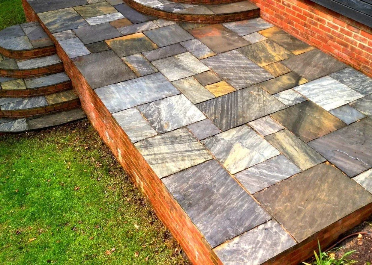 Cleaned sandstone patio with the stone's natural colour and variation showing again