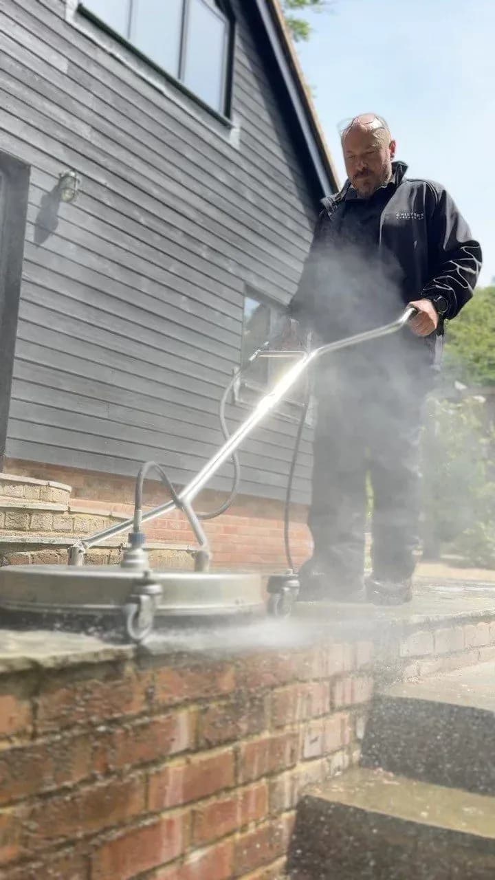 Rotary surface cleaner used for controlled cleaning of a natural stone patio