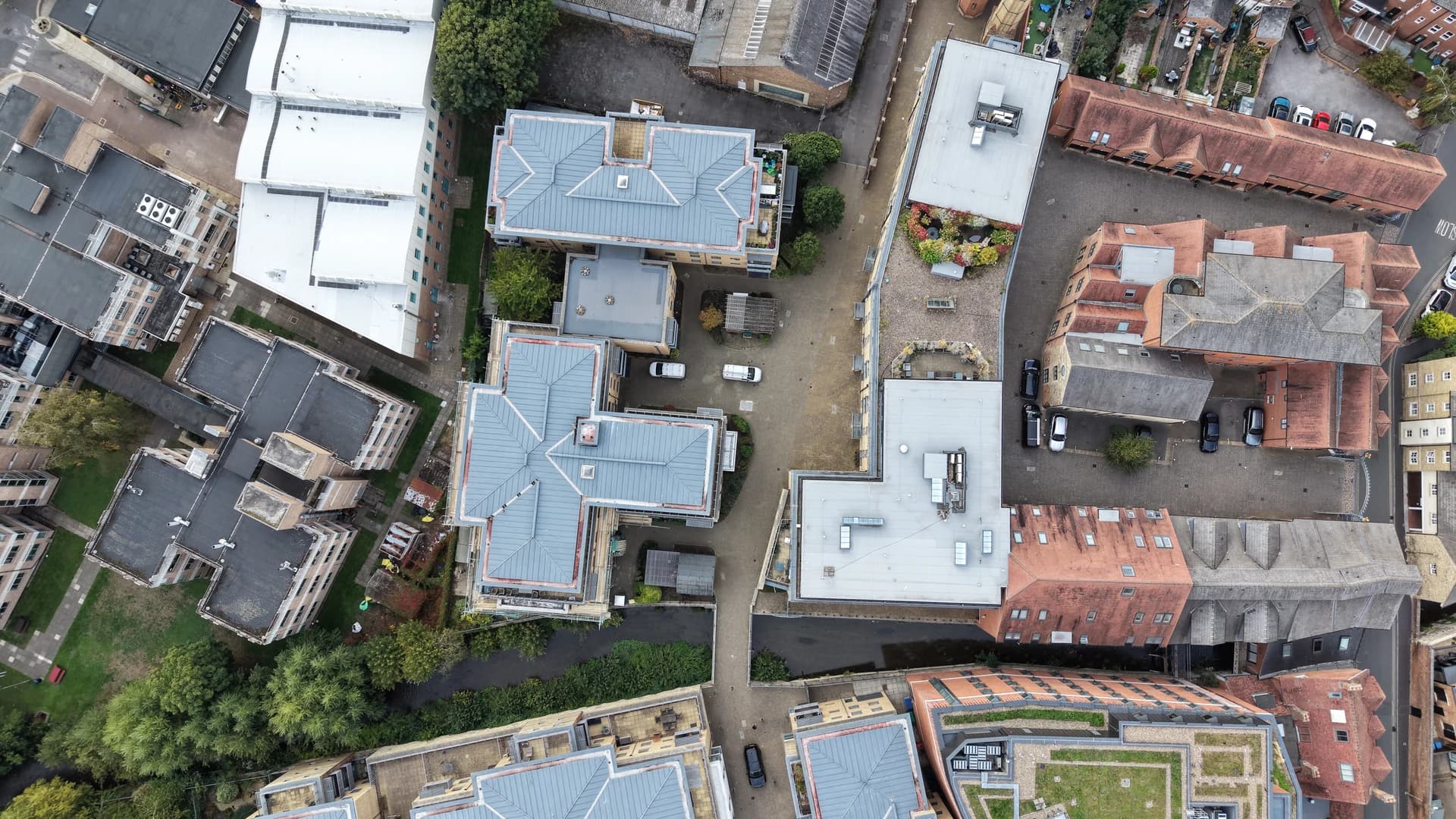 Near-overhead drone view of the same blocks, courtyard at centre.