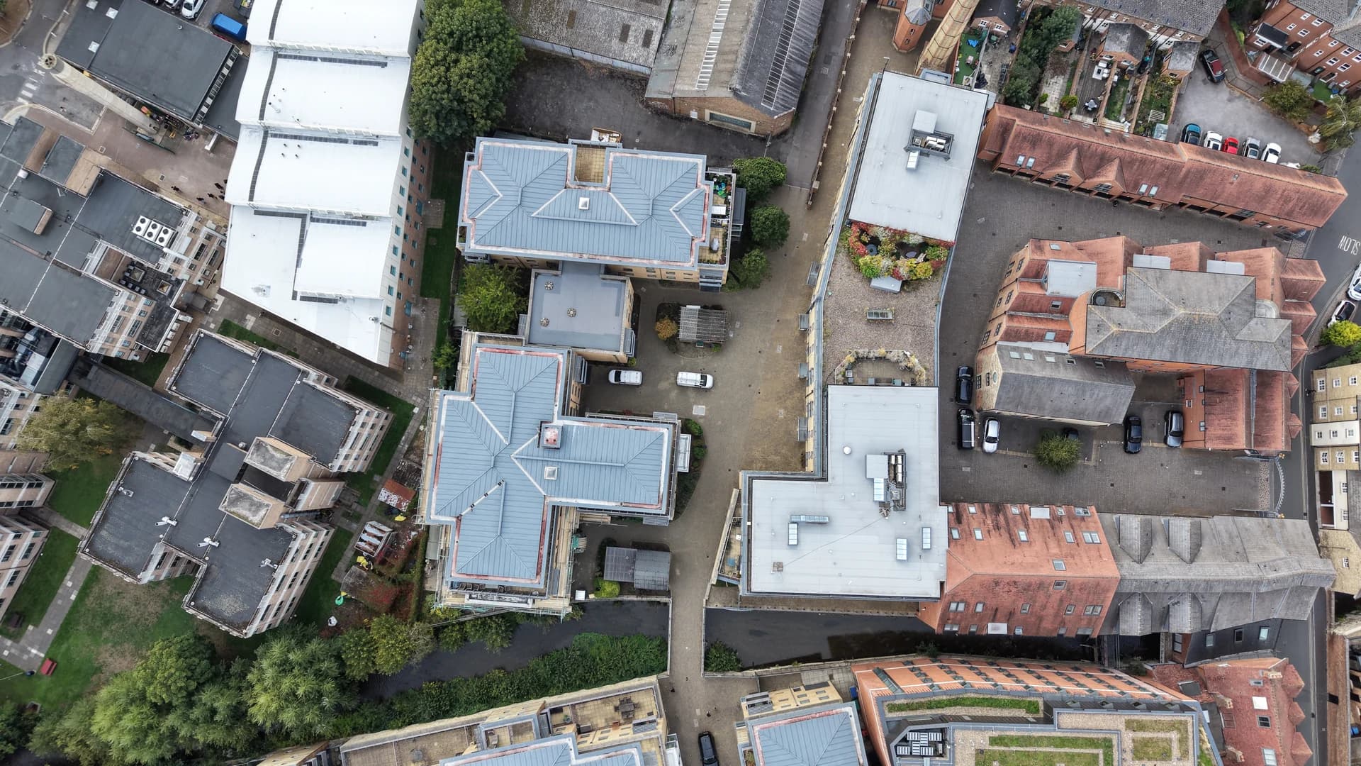 Overhead drone view of courtyard and blocks, near duplicate of 002.