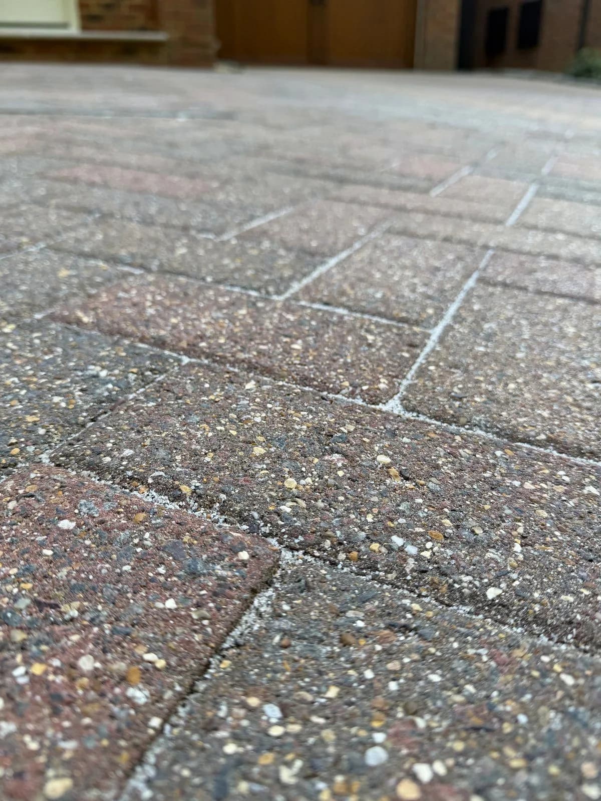 Tight close-up of the finished block paving in Hazlemere: cleaned blocks and new silver-grey polymeric sand joints