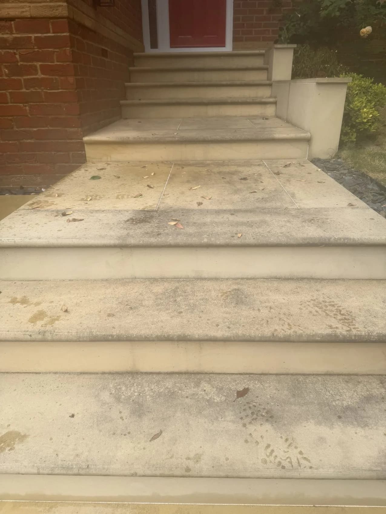 Weathered Indian sandstone entrance steps before cleaning in High Wycombe