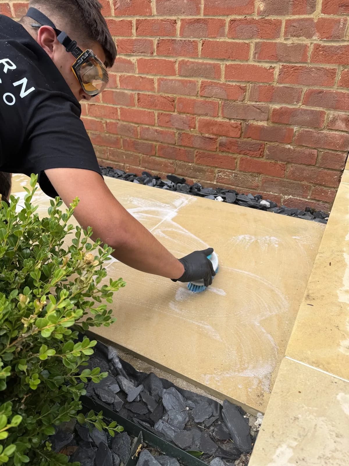 Treatment applied by hand to the Indian sandstone steps and assessed as the stone responds