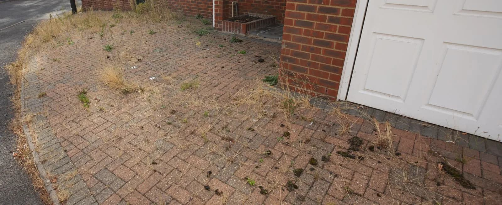Block paved driveway beside the garage before cleaning, Maidenhead