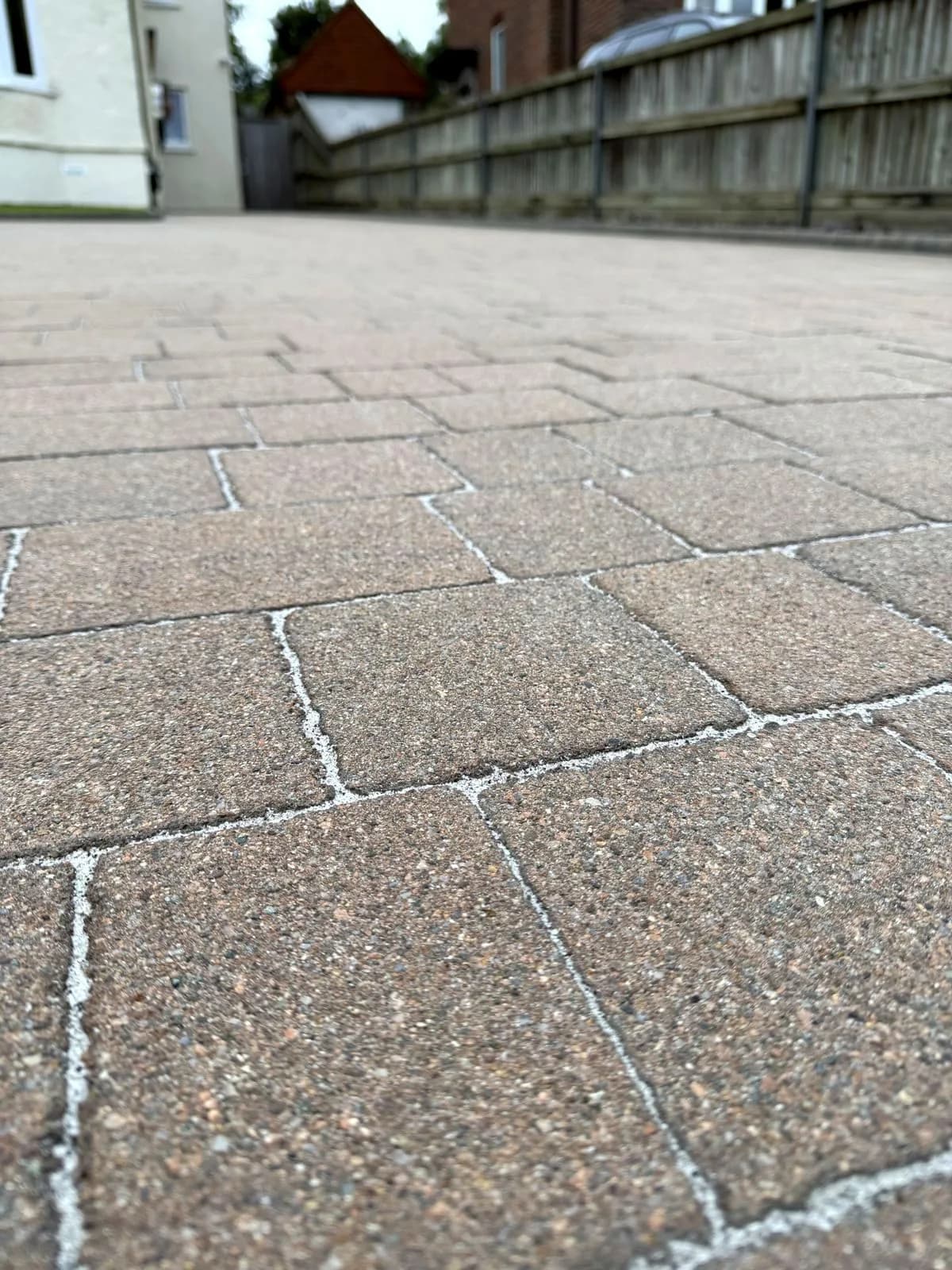Low close-up of the restored block paving with new polymeric sand joints after cleaning and Chiltern EverGuard™ treatment