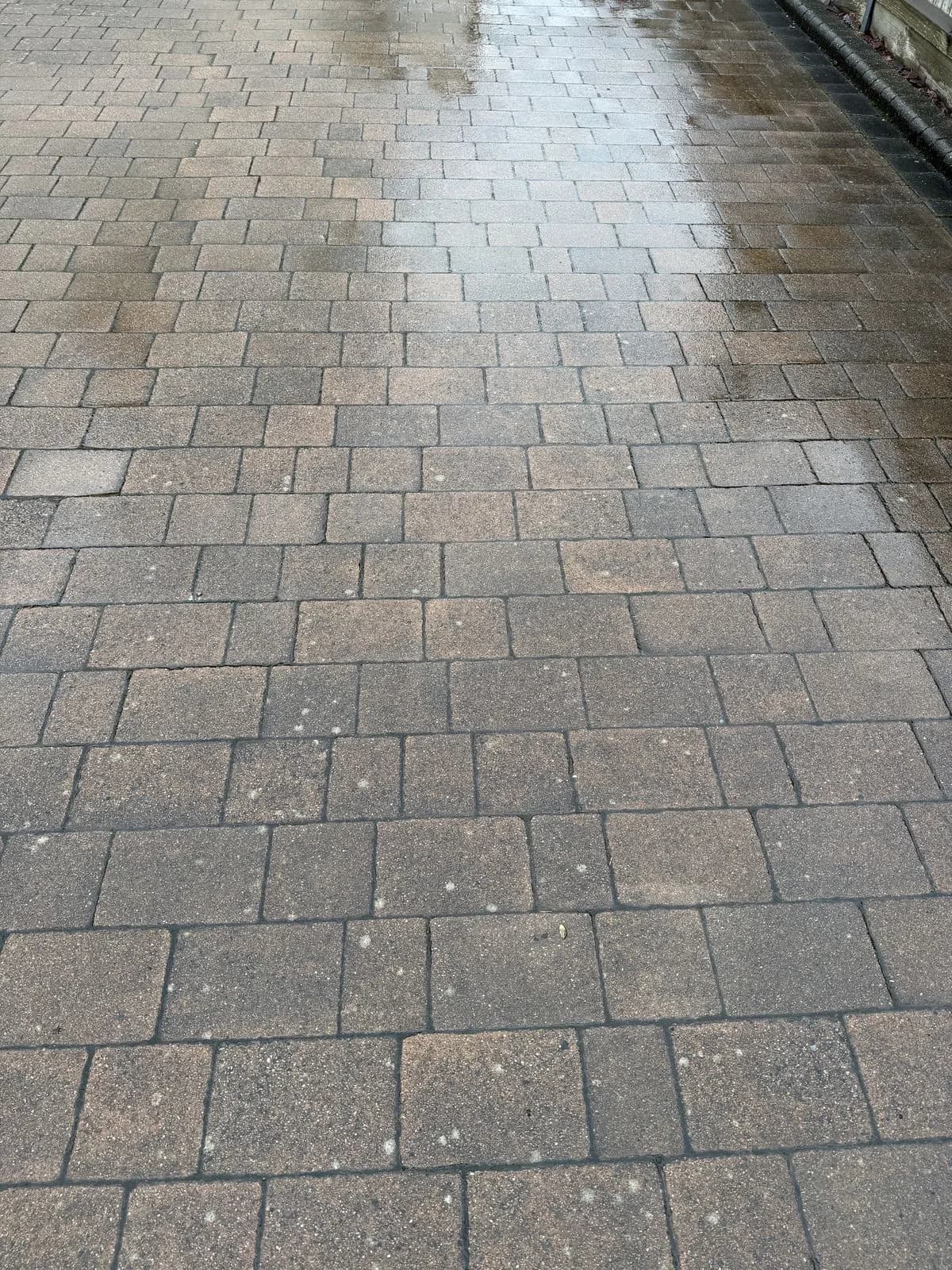 The block paved driveway in High Wycombe before restoration, weathered and heavily soiled