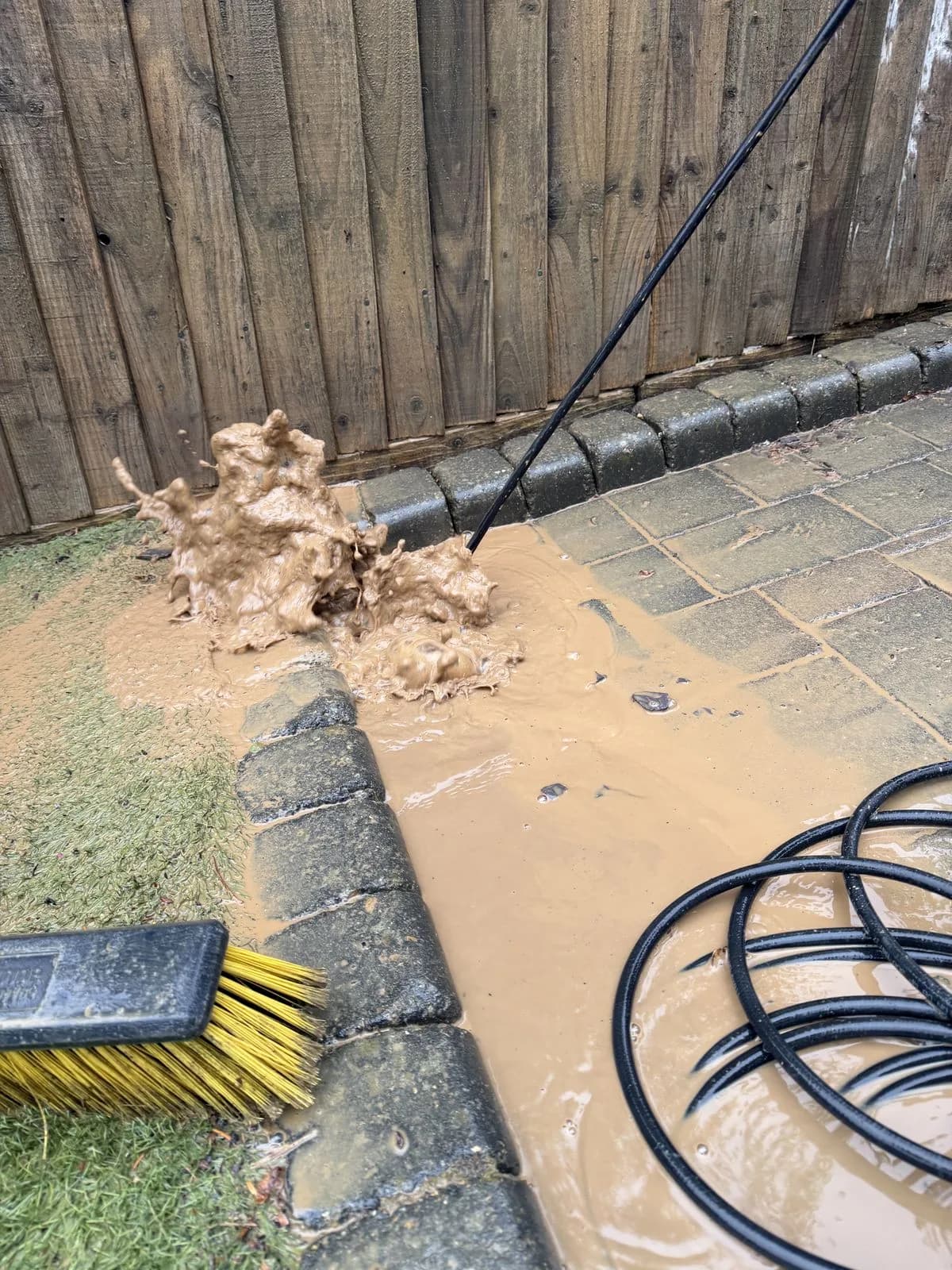 Silt and debris cleared from the blocked driveway drain during the High Wycombe restoration