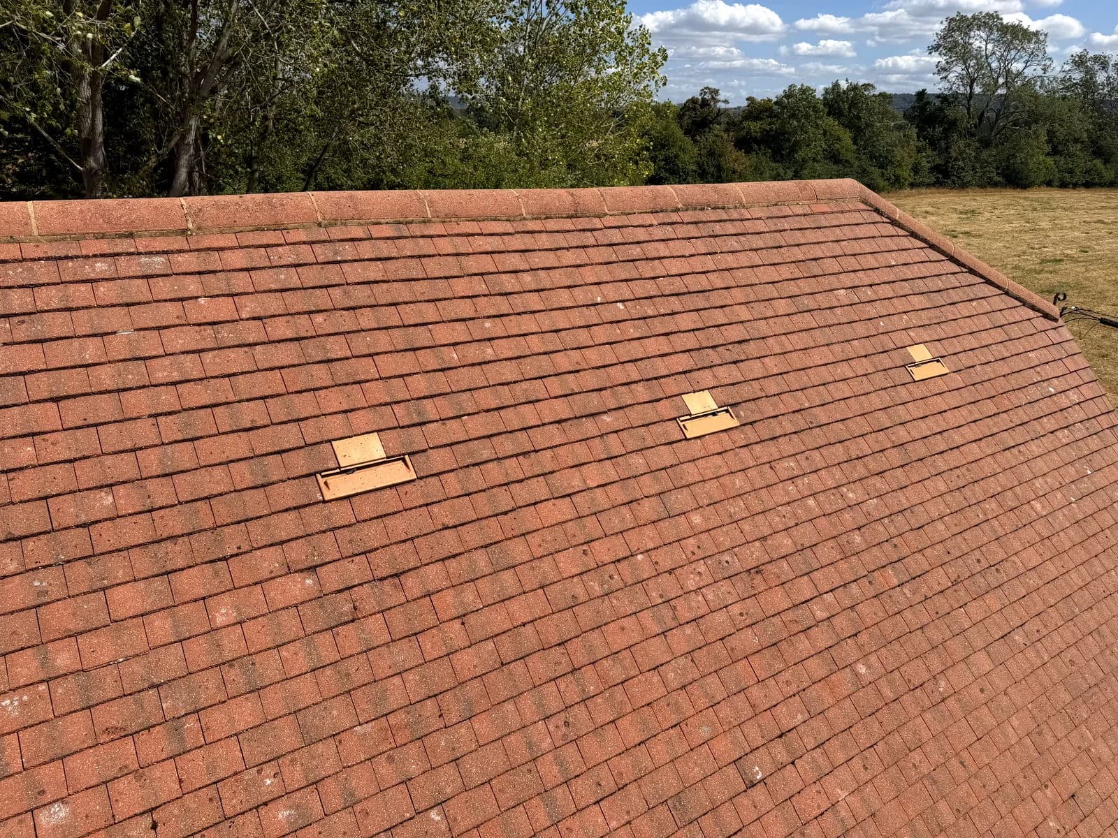 The cleaned clay tile roof of the annex in Aylesbury after moss removal and Chiltern EverGuard™ treatment