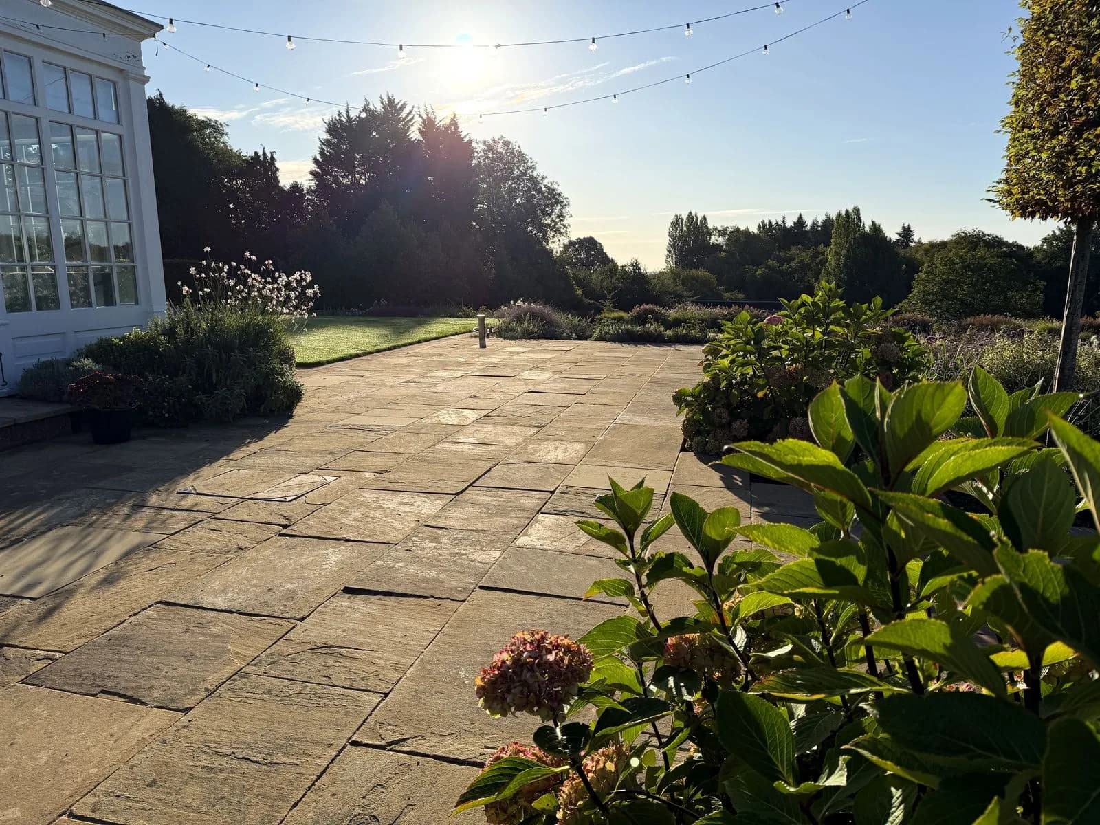 The finished Indian sandstone terrace in Henley-on-Thames after cleaning, relaying and repointing