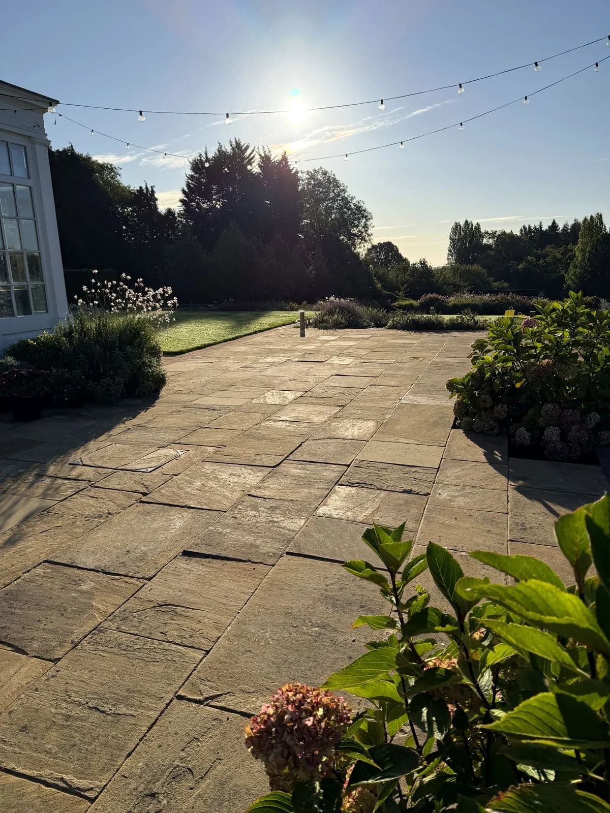 The same Indian sandstone terrace cleaned, relaid and repointed