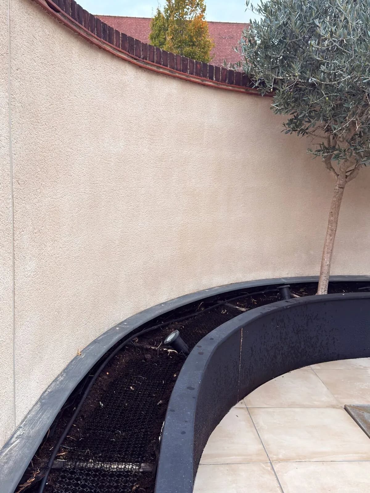 The same rendered wall after soft washing
