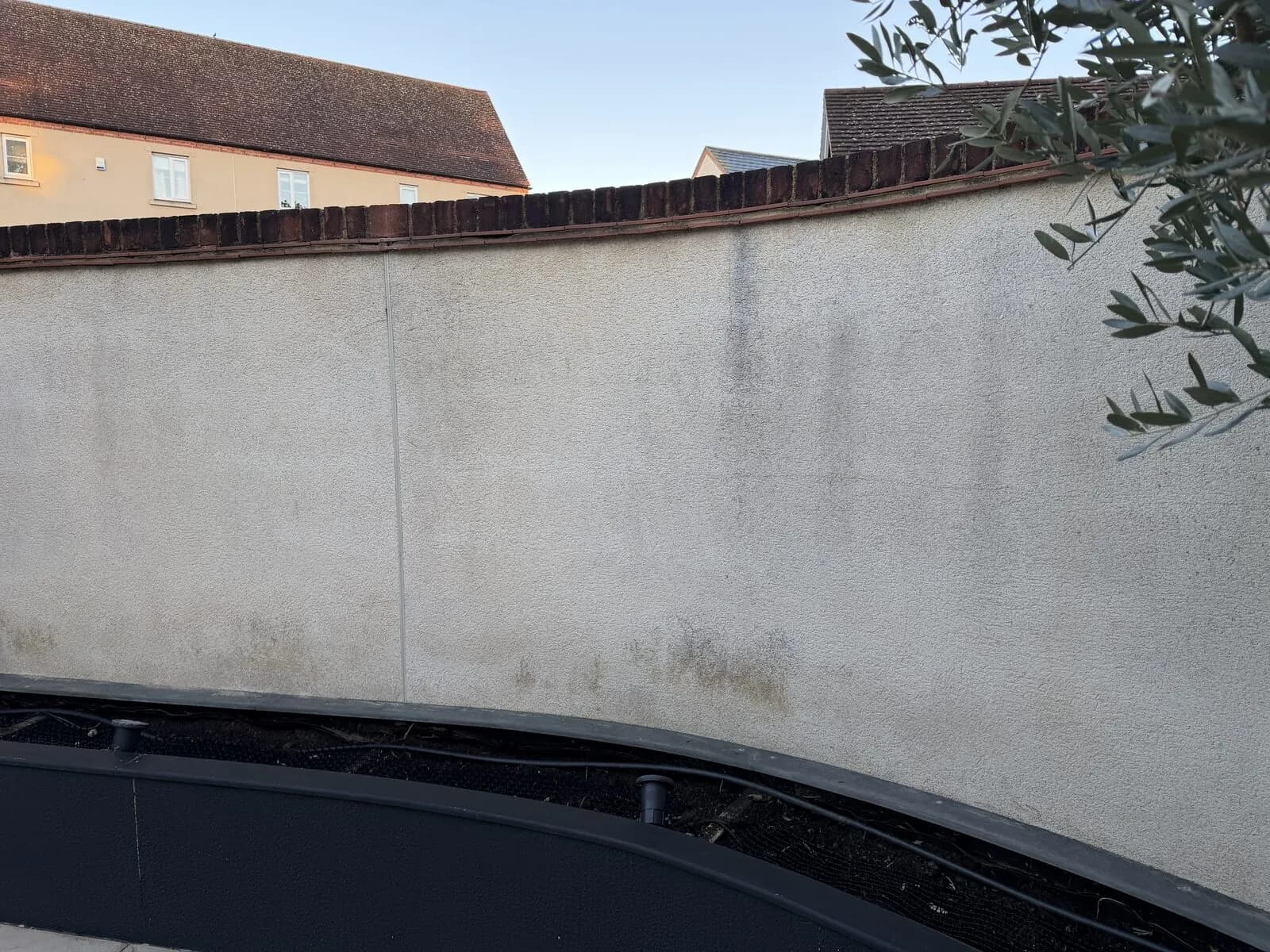 Rendered garden wall in Bicester before soft washing