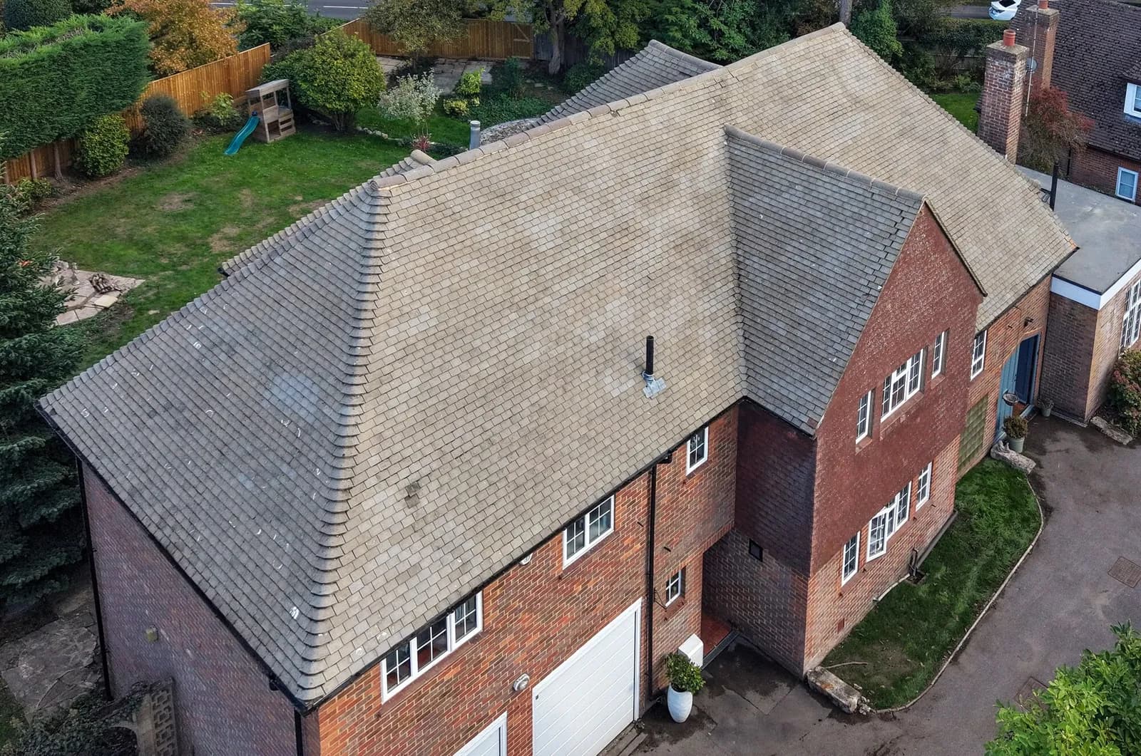 The same view of the roof on completion — clean buff tiles from eaves to ridge