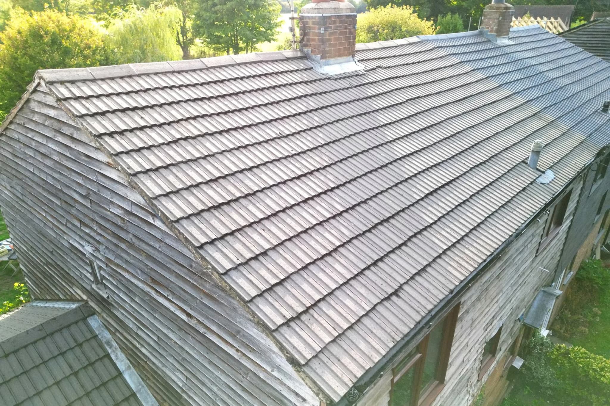 The same concrete tile roof in Henley-on-Thames after moss removal and Chiltern EverGuard™ treatment