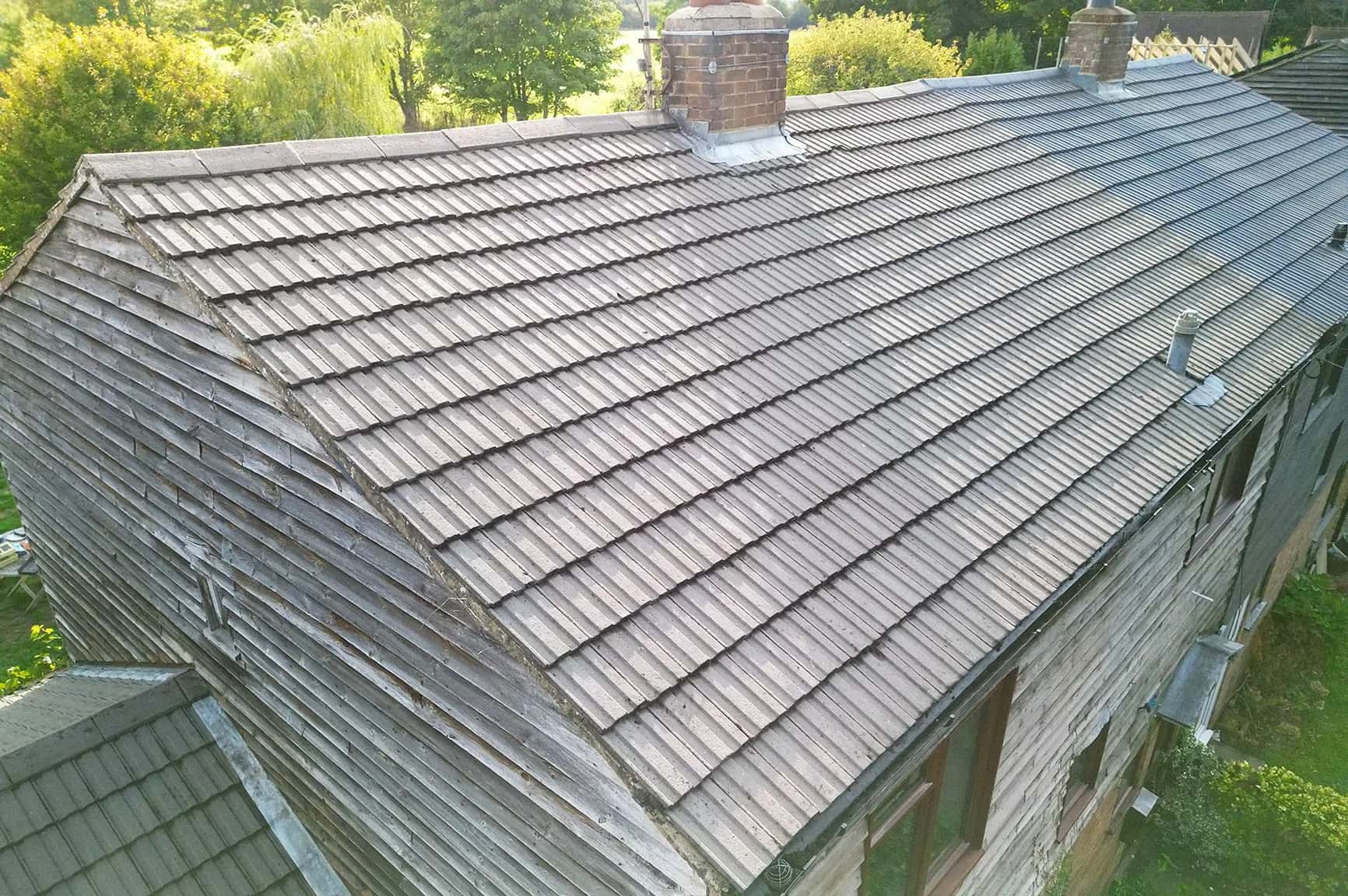 The same concrete tile roof in Henley-on-Thames after moss removal and Chiltern EverGuard™ treatment
