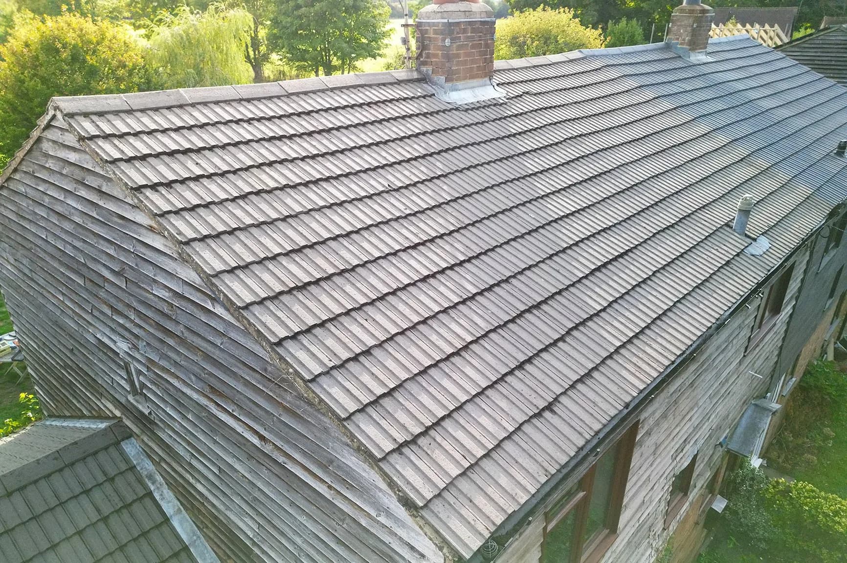 The same concrete tile roof in Henley-on-Thames after moss removal and Chiltern EverGuard™ treatment