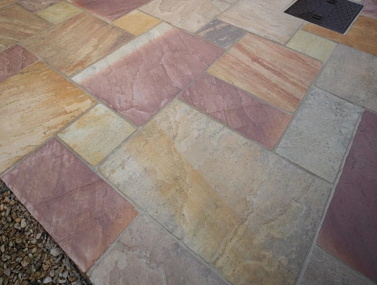 Purple, orange and warm mineral tones revealed in the cleaned sandstone