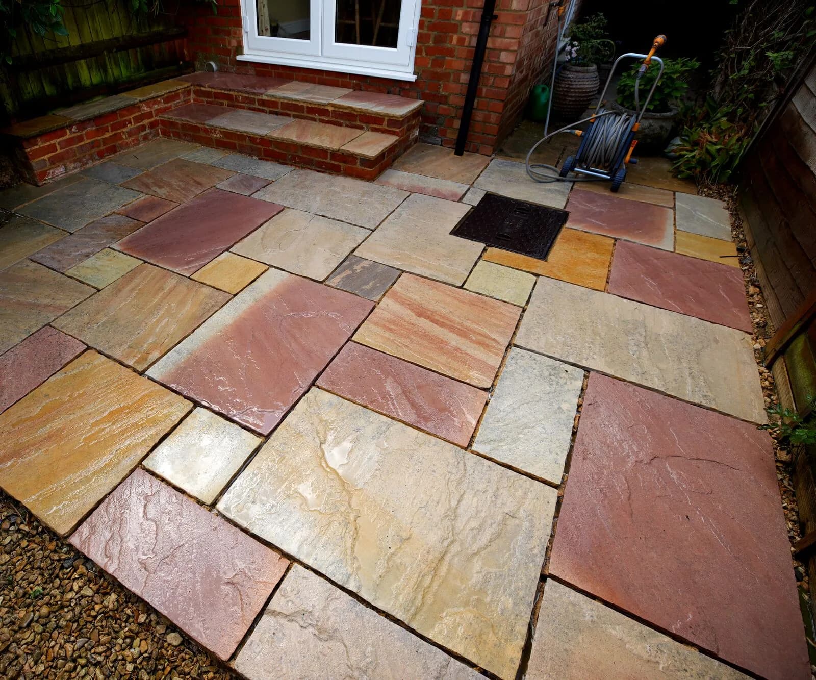 The restored sandstone patio in Oxford after cleaning and complete resin repointing