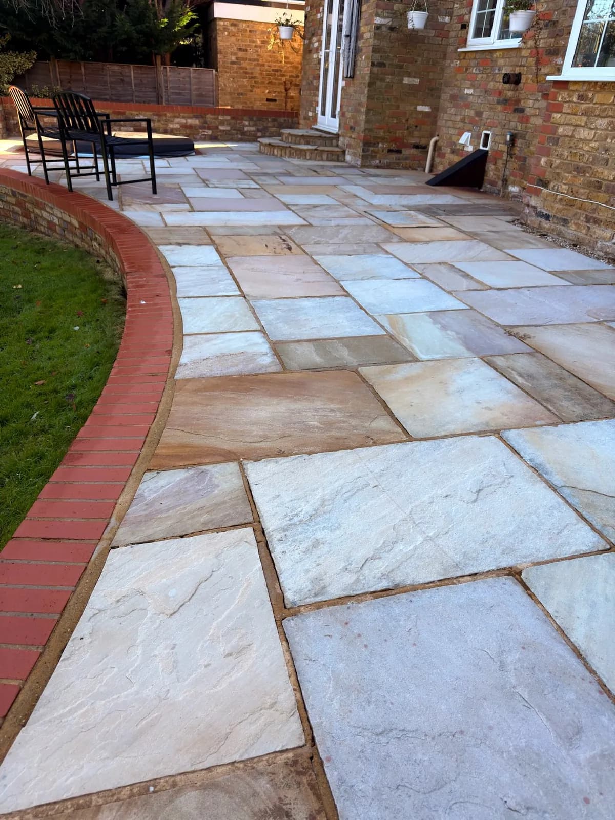 The same view of the sandstone patio on completion — cleaned, treated and protected with Chiltern EverGuard™