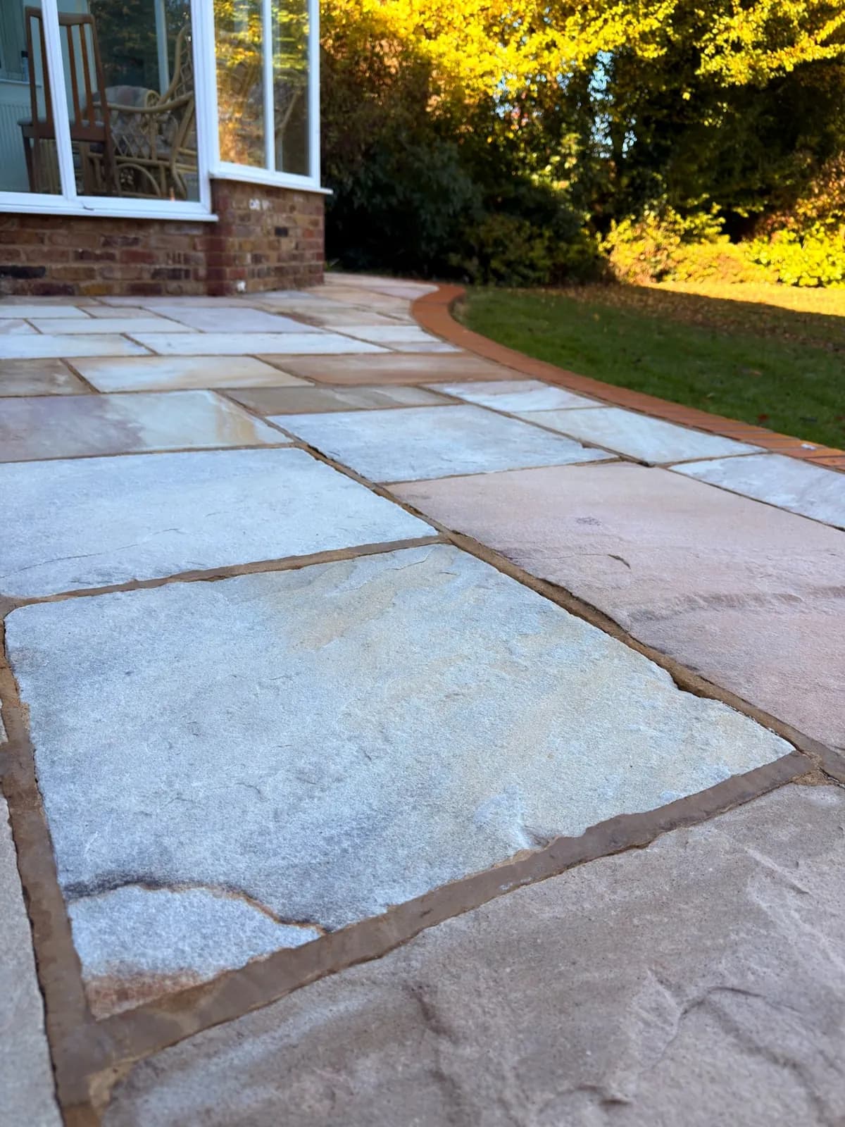 Indian sandstone slabs by the conservatory after cleaning, their warm colour back