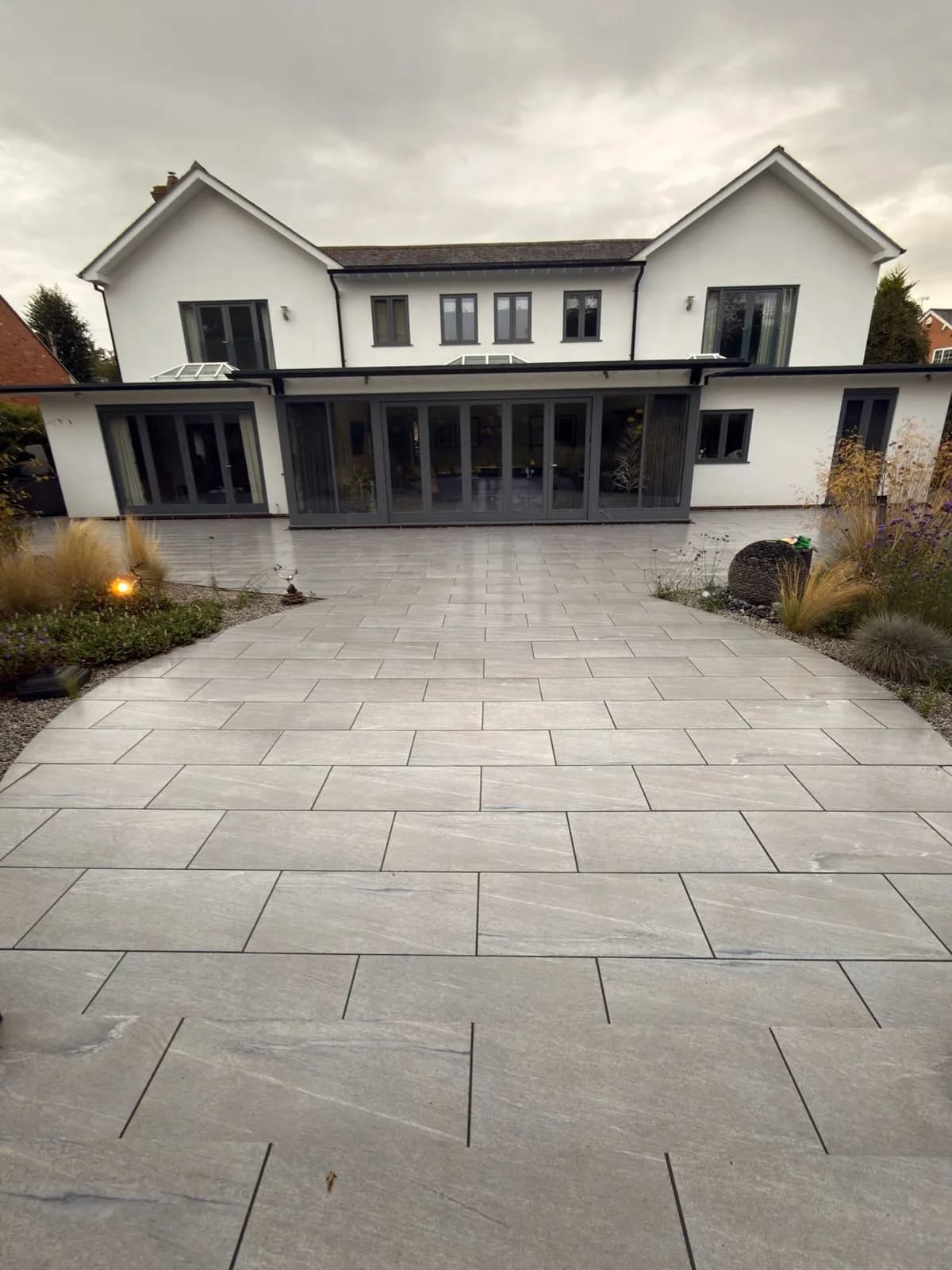 The rear of the house and the restored porcelain patio after soft washing and repointing